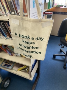 bags-2 A bag decorated with the slogan, "A book a day keeps unwanted conversation away".
